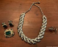 Full lot view: necklace, brooch, both earring pairs