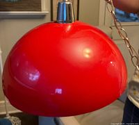 Red dome light side profile showing glossy finish and chrome cap