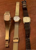 Front view of three wristwatches side by side