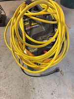 Air compressor with coiled hose