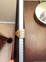 Front view of ring on mandrel displaying stone setting