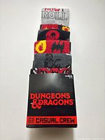 Front of sealed package showing stacked socks and branding