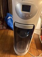 Front view showing water tank and control panel