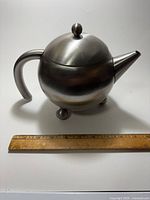 Full side view with ruler for scale showing overall design and dimensions