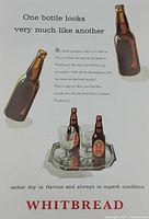 Full view of advertisement showing bottles, glasses, headline and logo