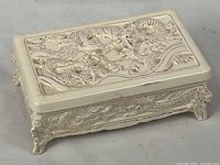 Top view of porcelain box showing raised dragon design on lid