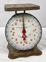 full front view of antique metal kitchen scale