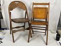 Both wood folding chairs side by side