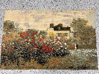 Full view of tapestry showing house and garden scene
