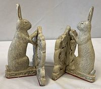 Front view of both rabbit bookends standing upright