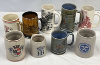 All nine mugs and steins lined up showing variety