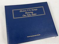 Closed navy binder front cover showing title and publisher