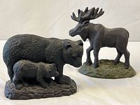 Front view of both cast iron animal doorstops