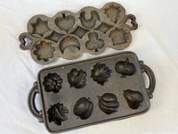 Both cast iron pans front view showing cavity shapes