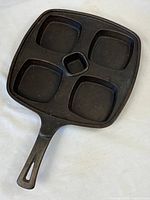 Full view of square cast iron skillet with handle