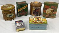 Group shot of six advertising tins