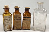 Group shot of four vintage tincture bottles