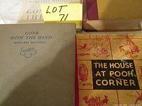 Four books laid out: Gone With The Wind, The House At Pooh Corner and two additional volumes partially visible