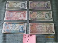 Six Canadian banknotes laid out showing fronts and denominations