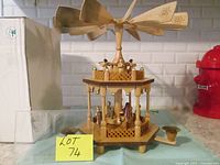 Full view of wooden Christmas pyramid with propeller and candle holders