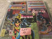 All nine comics fanned out, showing bags and boards, front issue unbagged