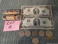 Overall lot with two $2 bills, Kennedy half-dollar coin, two nickel rolls