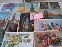 Group view of assorted colour and floral postcards