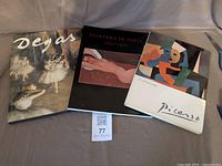 Front covers of Degas, Painters in Paris 1895-1950, and Picasso softcover books