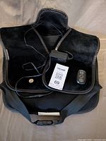 Front view of Snailax heating massage vest with power adapter and remote