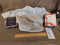 All items arranged: body wrap, head wrap, Spongellé box, Saje box