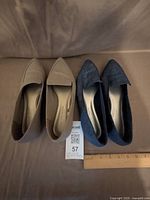 Top view of both pairs of flats showing colors and pointed-toe design