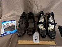 Both pairs of shoes and packaged foot pads on display