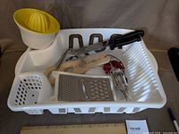 Overview of dish rack with utensils inside