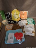 Full lot showing toner box, Sephora mask packs, Spongellé buffer, bath fizzer, headband, pouch