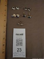 All six pairs laid out beside ruler for scale