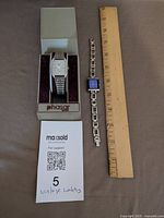 Two wristwatches with ruler and Phasar display box