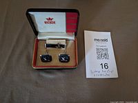 Open HICKOK case showing cufflinks and tie clip