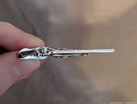 Side view of silvertone rifle tie clip