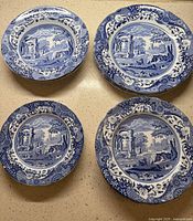 Stacked dinner plates, salad plates and bowls showcasing Blue Italian pattern