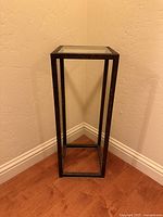 Full view of pedestal showing frame and glass top