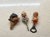 three carved wood bar tools laid out