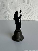 Front view of bell showing CALIFORNIA text and silhouette handle