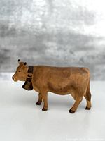 left side view of carved wooden cow