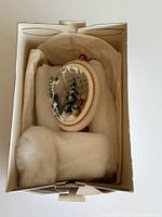 Ornament in original box with padding
