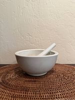 Side view of mortar and pestle showing size and color