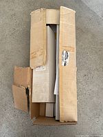 Cardboard shipping box opened showing contents