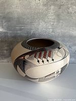 Front view of signed Mata Ortiz vase showing geometric designs