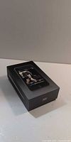 Retail box with iPod image displaying John Lennon artwork