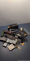 Pile of assorted model train parts and track pieces