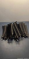 Stack of curved model railroad tracks